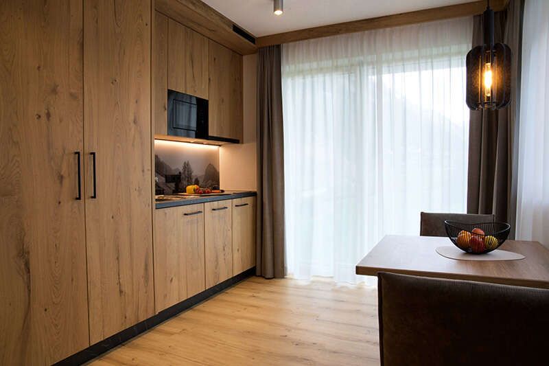 Kitchenette with seating area in Apartment Type A2