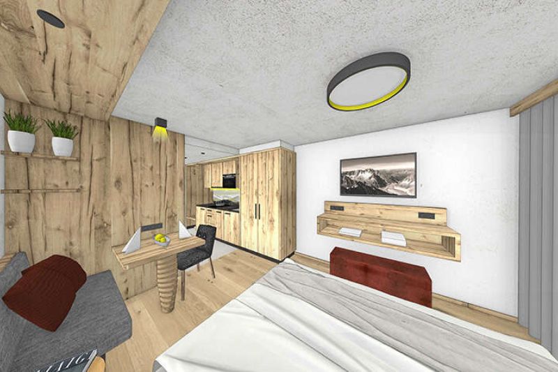 Zimmer mit Küchenzeile, Schreibtisch und Sitzgelegenheit im Appartement Typ A2